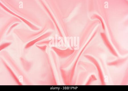 Smooth elegant pink silk or satin texture can use as wedding background. Luxurious background design. Stock Photo