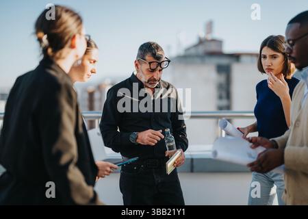 Multicultural business team brainstorming on outdoor terrace Stock Photo
