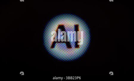 Super macro pixels of the display showing the word AI. Perfect for tech, security, and sci-fi concepts. Stock Photo