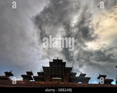 May 14, 2025: Rain clouds hover the sky above the Taleju temple at Hanumandhoka Durbar Square in Kathmandu, Nepal on May 14, 2024. Bishnu Adhikari, a woman of 80 years old from Kavrepalanchowk district lost her life in the fire caused by the gas leak early Wednesday morning, used to keep Nanglo shop below the Taleju temple. (Credit Image: © Sunil Sharma/ZUMA Press Wire) EDITORIAL USAGE ONLY! Not for Commercial USAGE! Stock Photo