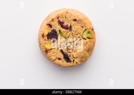 Cookie biscuit made of oats, butter, nuts and dried fruits isolated on white Stock Photo
