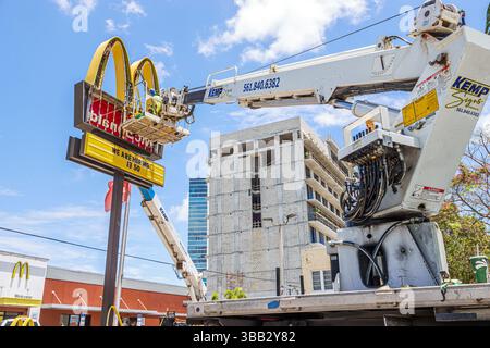 Miami Florida,Midtown Biscayne Boulevard,McDonald's fast food restaurant,workers servicing Golden Arches sign,KEMP Signs boom truck lift crane,WE ARE Stock Photo