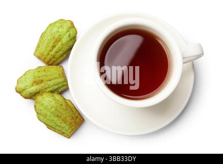 Tasty matcha madeleine cakes and tea isolated on white, top view Stock Photo