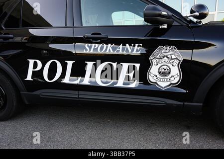 Spokane, WA, USA - May 2, 2025; Spokane Police name and shield design on black and white vehicle door Stock Photo