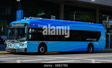 Spokane, WA, USA - May 2, 2025; Spokane Transit battery electric zero emission blue bus on city street Stock Photo
