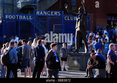 Rangers fans and the statue of Walter Smith outside the ground ahead of the William Hill Premiership match at Ibrox Stadium, Glasgow. Picture date: Wednesday May 14, 2025. Stock Photo