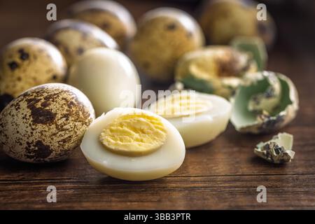 Boiled quail eggs on a wooden table. Stock Photo