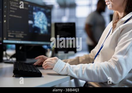 Technician in artificial intelligence ran data center coordinating deployment of server architecture. Machine learning expert in server hub configuring and testing equipment Stock Photo