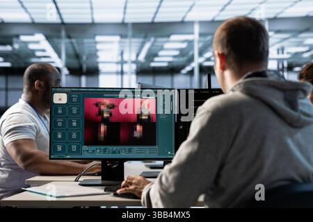Engineer in server hub coding AI program turning text prompt into photos. IT specialist in data center using computer to build text to image artificial intelligence generative models Stock Photo