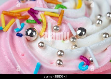 White and pink whipped cream with sprinkles Stock Photo