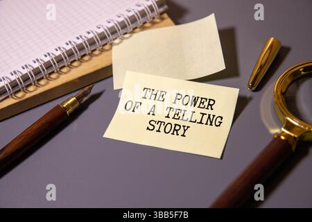 Finance and economics concept. Magnifier on a white backgroundd, inside the text is written THE POWER OF STORYTELLING Stock Photo