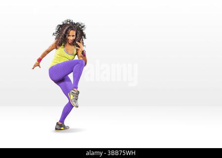 A young woman at fitness exercise or zumba dancing Stock Photo