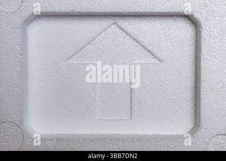 Arrow pointing up footprint on white  styrofoam Stock Photo