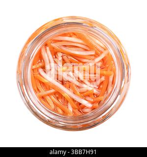 Pickled carrot celery salad in open screw-top glass jar, from above. Carrots and celery root cut into long thin strips, preserved in brine. Stock Photo