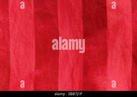 Red fabric with vertical lines textured abstract background Stock Photo