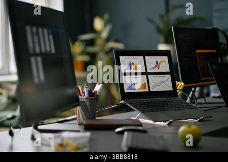 Workspace with computer screens displaying various data graphs and charts. Modern office setting with a focus on technology and data analysis making i Stock Photo