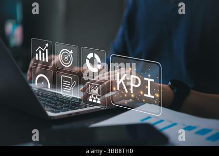 KPI dashboard concept showing hands on laptop with analytics icons charts and targets. Perfect for business growth, data data marketing innovation str Stock Photo