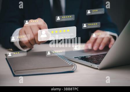 Digital customer satisfaction ratings, business person analyzing client reviews, online feedback management, virtual star rating system, user evaluati Stock Photo