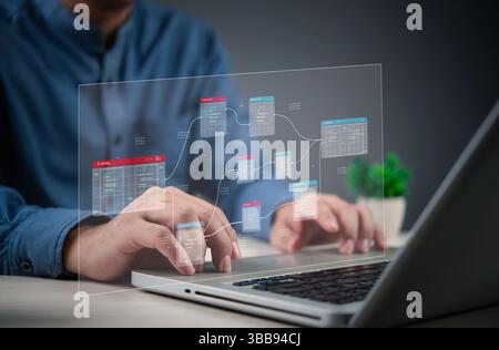 programmer working on database web developer management with a futuristic digital interface, representing data analytics and IT technology. Stock Photo