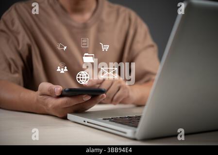 Digital business tools concept with user holding smartphone, using cloud apps for email, shopping, marketing, communication, ads and file management. Stock Photo