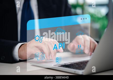 A software developer working on an API integration project with database and cloud services, demonstrating digital transformation in IT. Programming c Stock Photo