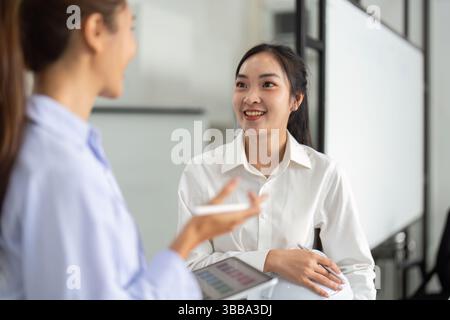 Positive Engagement in Architecture. Two engineers sharing ideas in a collaborative meeting. Stock Photo