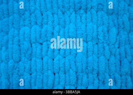 Blue knitted background. Bright blue woven texture Stock Photo