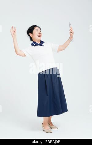 Chinese elderly women using smartphones​ Stock Photo