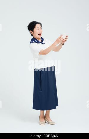 Chinese elderly women using smartphones​ Stock Photo