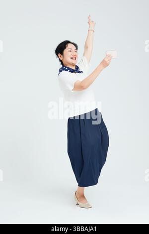 Chinese elderly women using smartphones​ Stock Photo