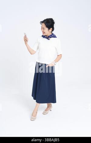 Chinese elderly women using smartphones​ Stock Photo