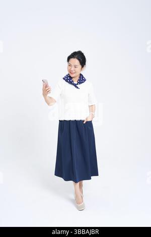 Chinese elderly women using smartphones​ Stock Photo