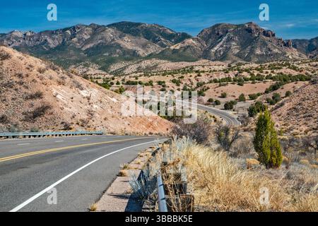 Sheridan Mtn on right, Holt Mtn on left in Mogollon Mtns, from US-180 over Little Dry Creek near settlement of Glenwood, Gila Natl Forest, New Mexico Stock Photo