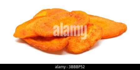 Dried carrot chips portion on a white background side view. Stock Photo