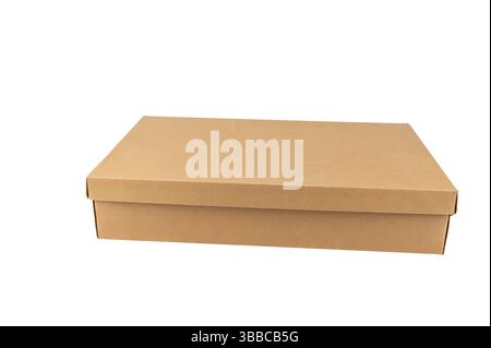 A wide and flat cardboard box stands facing forward on a white surface. Ideal for larger products or clothing. Stock Photo
