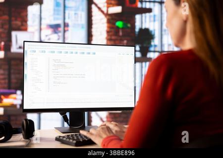 Freelancer uses the pc virtual assistant via artificial intelligence to provide real time solutions, AI software highlights how technology supports efficient data analysis and problem solving. Stock Photo