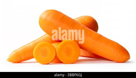 Side view of three fresh orange carrot roots with slices in circles in stack is isolated on white background with clipping path. Stock Photo