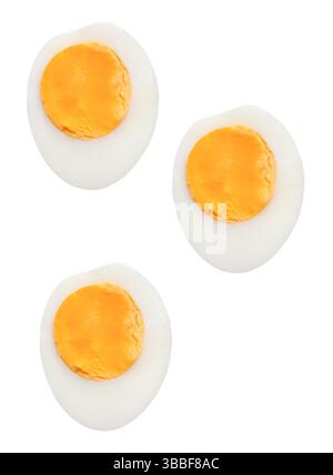Top view set of boiled or cooked chicken eggs with egg yolk in three halves is isolated on white background with clipping path. Stock Photo