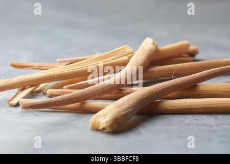 close-up of scattered odiyal or palmyra palm sprouts gray textured background, young shoots of palmyra tree, traditional sri lankan snack Stock Photo