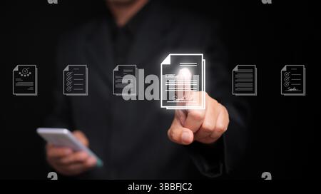 Document Management System concept. A man with his smartphone searches for a file stored in the DMS system for store, share, track and manage files or Stock Photo
