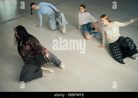 Practicing Dance Moves in Modern Dance Studio Stock Photo