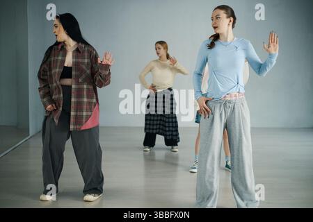 Practicing Dance Moves in Modern Studio Setting Stock Photo
