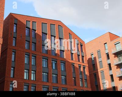 Contemporary Modern Red Brick Architectural Design Featuring in an Urban Setting and Landscape Stock Photo