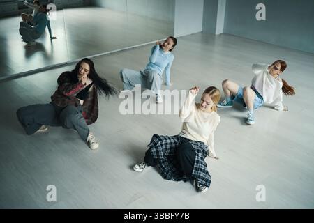 Group of Dancers Practicing Hip-Hop Routine in Studio Stock Photo
