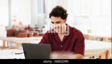 Pottery, laptop and man in workshop for inventory, quality control and checklist of ceramic designs. Creative business, art studio and person on Stock Photo