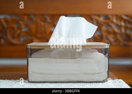 Acrylic Tissue Box on wooden table Stock Photo
