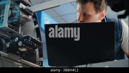 Display Screen of ATM Machine. Focus on Technician in Uniform Using Laptop, Adjusting Internal Components and Servicing Automated Teller Machine in Modern Airport Terminal. Cash Withdrawal Systems. Stock Photo