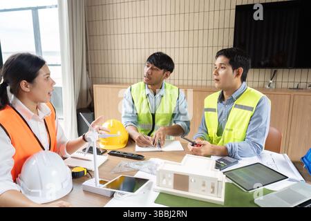 Engineers collaborating on sustainable project planning Stock Photo