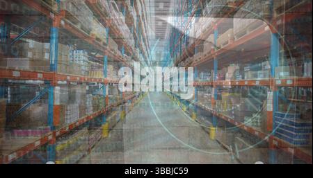 Showing empty central aisle stretching inside warehouse, with storage racks and cardboard boxes Stock Photo