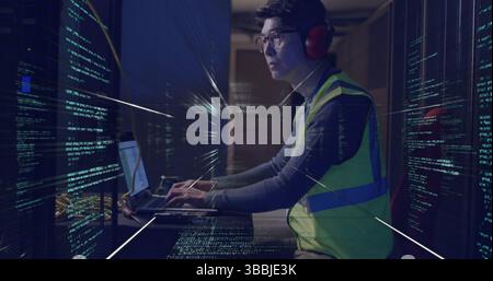 Image of data processing over asian man working in server room Stock Photo
